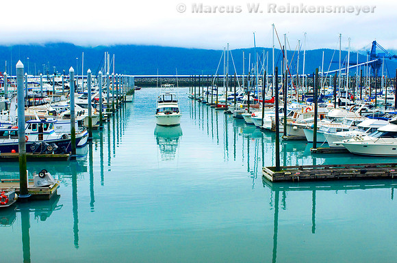 Boats galore and clear blue waters at Seward, Alaska, a scenic community located at the head of Ressurection Bay on the Kanai Peninsula, Alaska.