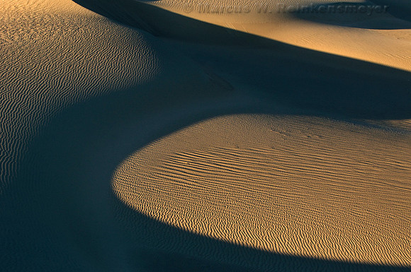 Minimalistic abstract patterns of nature, shaped by endless winds and rains at the Mesquite Flat Dunes, Death Valley National Park, California.