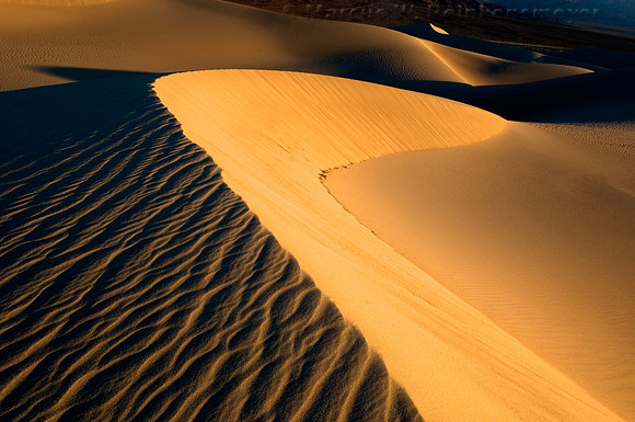 Minimalistic abstract patterns of nature, shaped by endless winds and rains at the Mesquite Flat Dunes, Death Valley National Park, California.