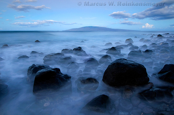 Lue misty shoreline, a time exposure image captured in the pre-dawn light at a Beach near Lahaina, Maui, Hawaii.