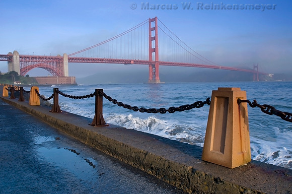 Golden Gate Bridge viewed at daybreak from the park, after heavy rainfall. San Francisco, California.