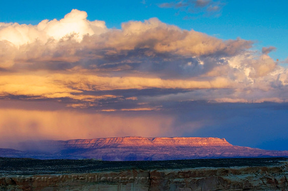 Storm on the mountain horizon, viewed from Alstrom Point, Lake Powell, Utah.