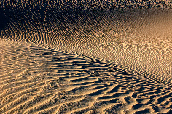 Minimalistic abstract patterns of nature, shaped by endless winds and rains at the Mesquite Flat Dunes, Death Valley National Park, California.