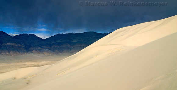 Rain storm on the Last Chance Mountains range, viewed from the Eureka Dunes. Death Valley National Park, California.