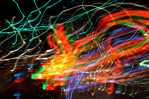 Time exposure night life and neon lights at Tropical Isle on Bourbon Street, New Orleans, Louisiana.
